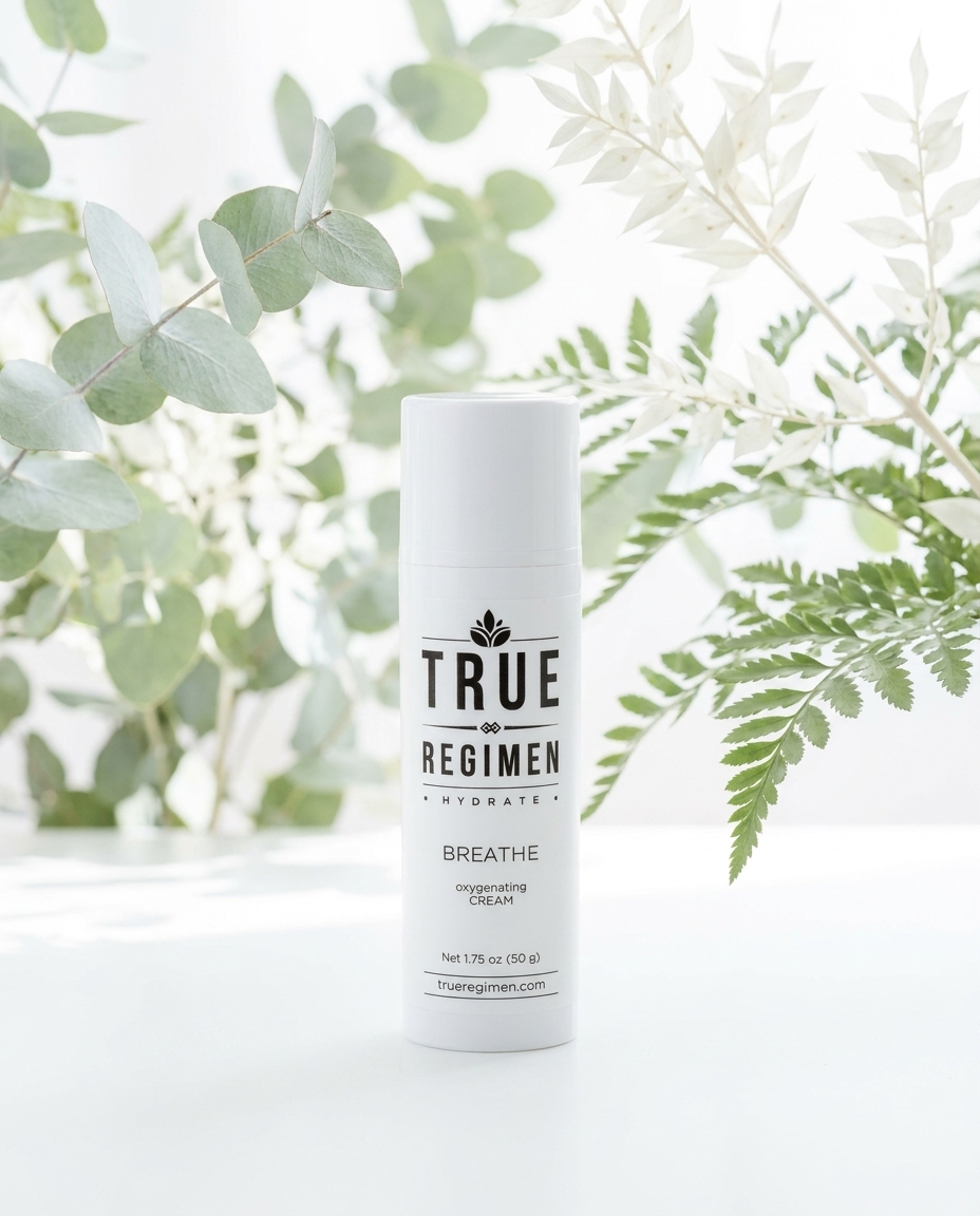 True Regimen Breathe oxygenating moisturizer styled on a marble vanity in soft window light