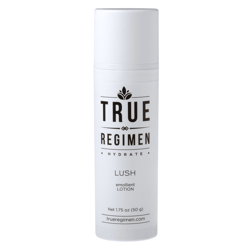True Regimen Lush niacinamide barrier lotion in a frosted glass bottle with a black pump on a clean white background