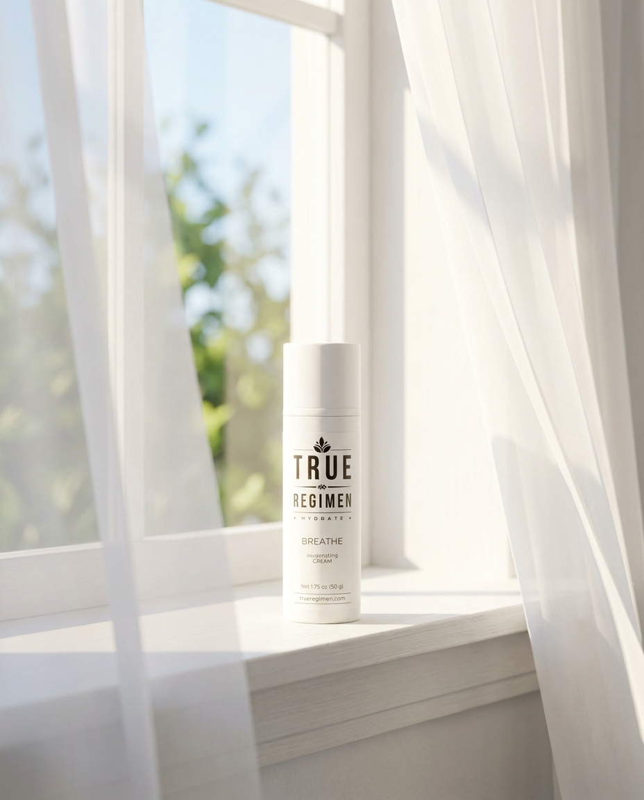 True Regimen Breathe oxygenating moisturizer beside a white towel in a bright, airy bathroom setting