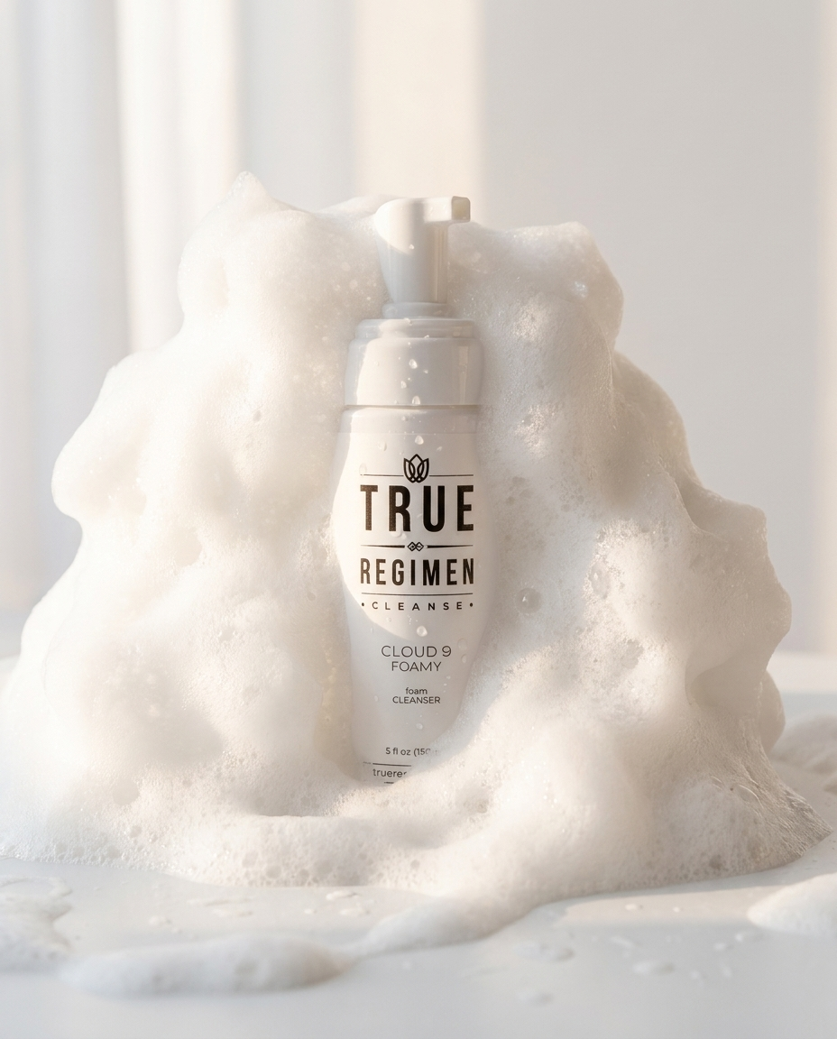 True Regimen Cloud 9 Foamy Cleanser styled on a marble vanity in soft window light