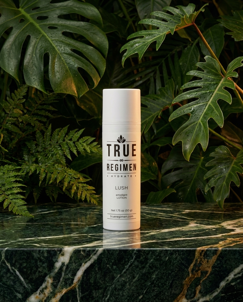 True Regimen Lush barrier lotion styled on a marble vanity in soft window light